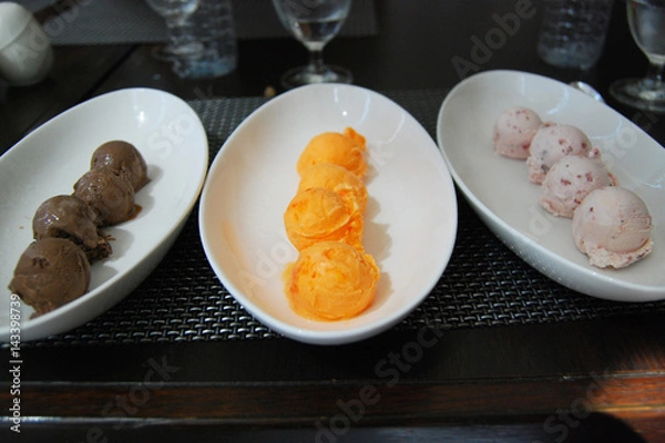 Obraz Sixteen scoops of ice cream (Chocolate , Orange sherbet and Strawberry flavors)