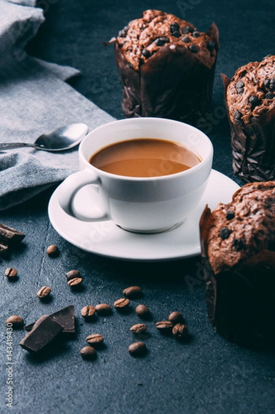 Fototapeta Chocolate muffins and coffee on a dark background