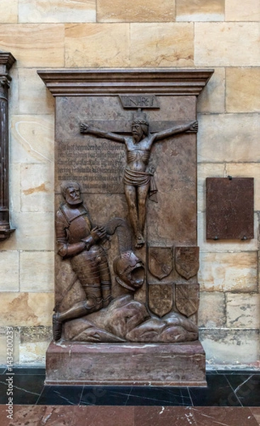Fototapeta Knightly burials in side niche of St Vitus Cathedral facade in historical part of Prague in Czech Republic