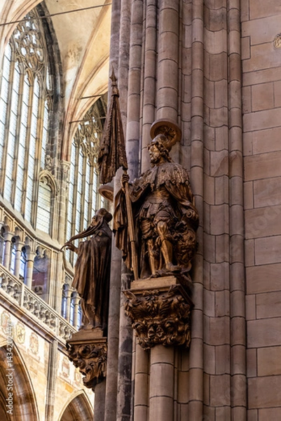 Fototapeta Large gilded statue on pillar in St Vitus Cathedral in historical part of Prague in Czech Republic
