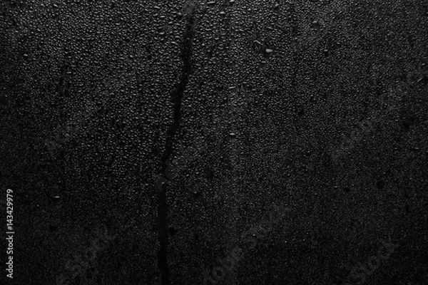 Fototapeta Part of series. Background photo of rain drops on dark glass, different size: small medium and large
