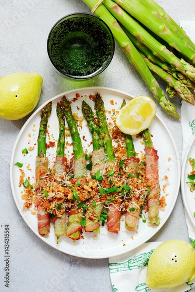 Obraz Asparagus baked in bacon with spicy crumble..top veiw