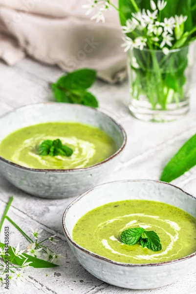 Fototapeta Two bowls of wild garlic soup on light gray background