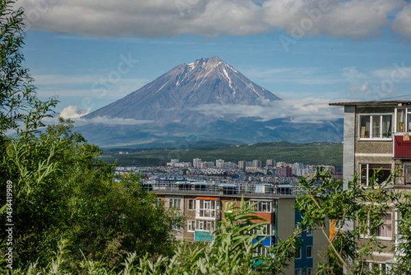 Fototapeta City with a volcano in the background