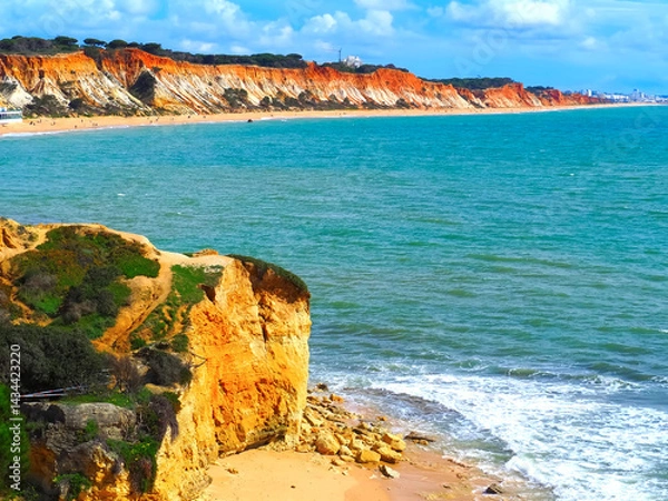 Fototapeta Algarve beach at Olhos de Agua with red cliffs at the coast of south Portugal
