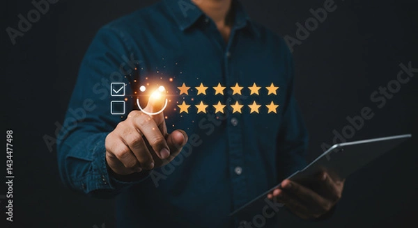 Fototapeta A person touching a digital interface with stars and a smiley face, holding a tablet in dim lighting selling, purchasing,$, agreement
