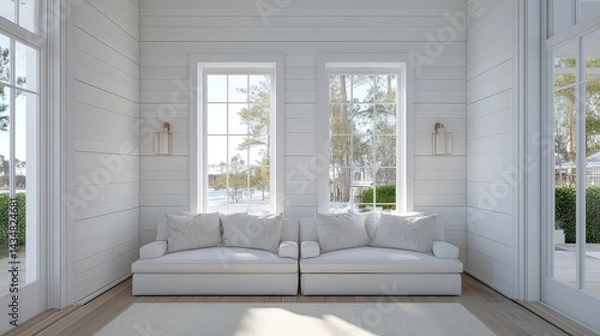 Fototapeta Open family reading space with twin couches, soft decor, and white walls.