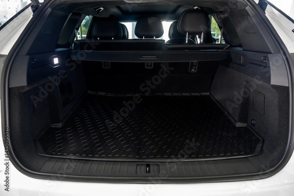 Fototapeta Large black empty car trunk. Open car trunk close up