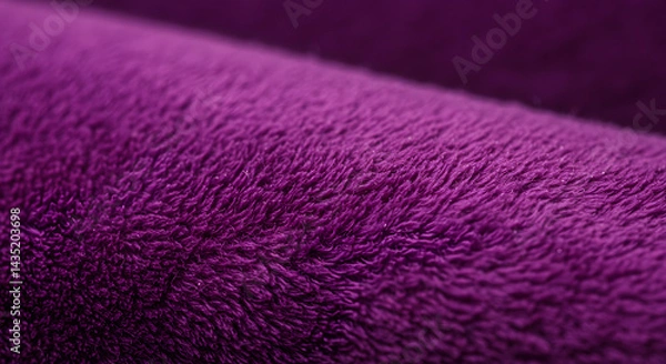 Obraz Close-up macro photograph of a deep purple plush fabric.  The texture is soft and fluffy, showing a subtle gradient in shade. The image emphasizes the fabric's tactile quality.