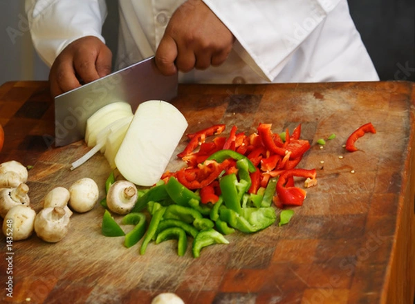 Obraz chef cutting vegetables close up