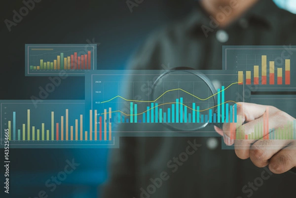 Fototapeta Monitoring trends and statistics using magnified analytics tools.