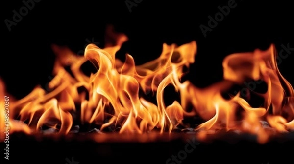 Obraz Vivid flames dancing on a dark background, showcasing the intense beauty and power of fire in natural settings.