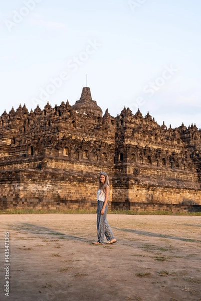 Obraz Tourist woman walking at candi borobudur temple in java, indonesia