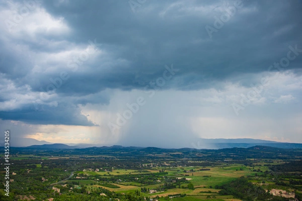 Fototapeta Stormy summer landscape in French Provence. Picturesque photo before a thunderstorm.