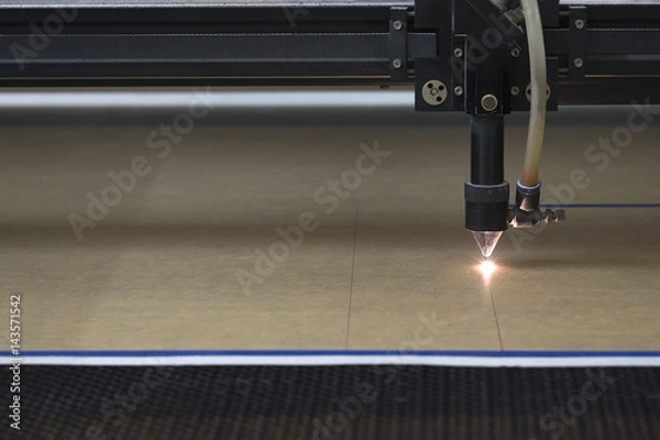 Fototapeta cutting machine carving patterns on the plastic plate