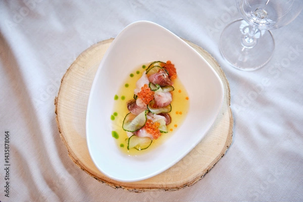 Obraz salad with fish and red caviar on a plate