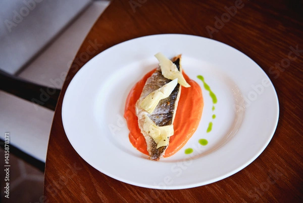 Obraz fish with sauce on a plate