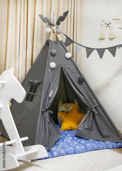 Fototapeta Playroom with Teepee. Modern room interior with play tent for child. children's wigwam in the room on the floor Scandinavian style with decor. children's play area
