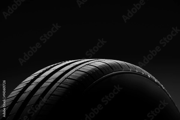 Obraz Car tire on black background