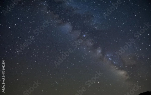 Fototapeta A photo of the night sky with stars and the Milky Way galaxy visible