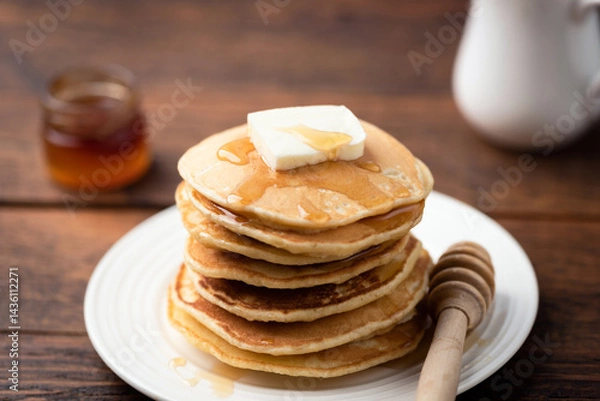 Fototapeta Stack of pancakes with butter and maple syrup