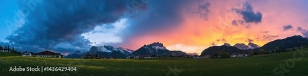 Fototapeta Happy woman standing with her back on sunset in nature . Panoramic view of a colorful sunset created by ai