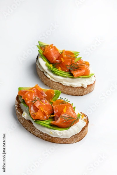Fototapeta sandwiches with salmon and cheese, meat and tomatoes on a white background