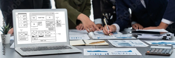 Fototapeta Panorama shot analyst team utilizing BI Fintech to analyze financial report with laptop. Businesspeople analyzing BI data dashboard displayed on laptop screen for business insight. Prodigy