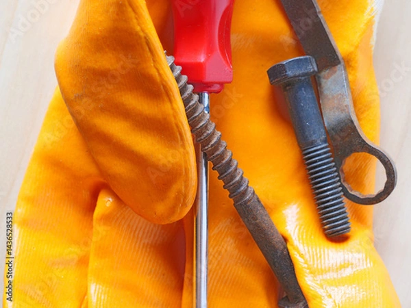 Fototapeta close-up repair tools on work gloves
