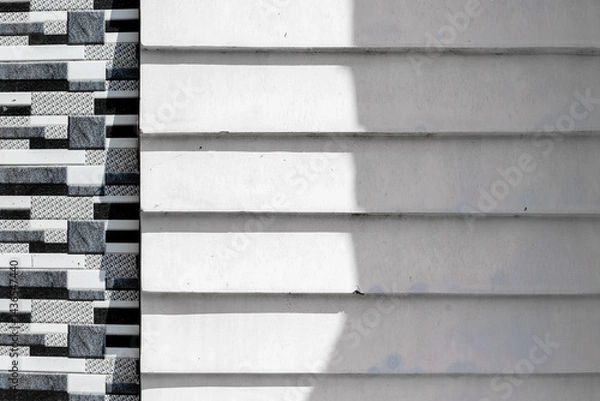 Obraz Contrasting architectural patterns on textured building facade