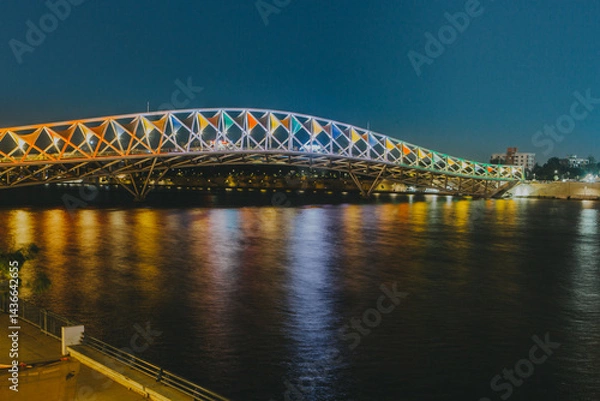 Fototapeta Atal Bridge is a pedestrian triangular truss bridge at Sabarmati Riverfront on Sabarmati River in Ahmedabad, Gujarat. Its design is inspired by kites and was inaugurated in 2022
