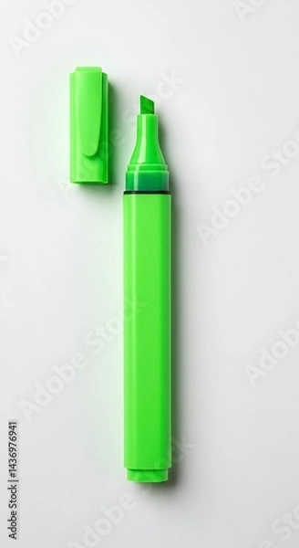 Fototapeta A vibrant green highlighter with its cap off sits on a clean white background, ready to add emphasis to text or other important information.