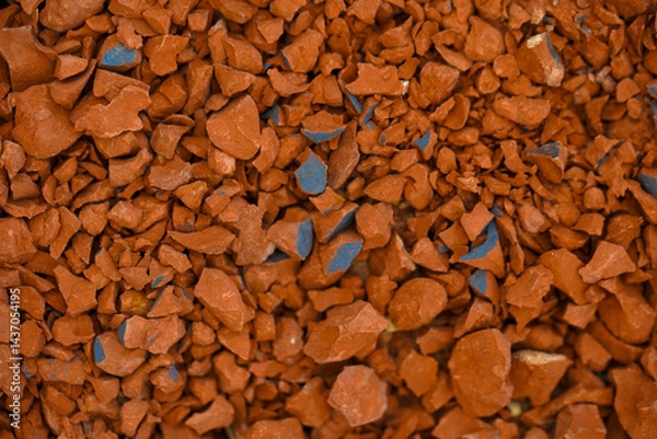Fototapeta Small pieces of broken red sandstone