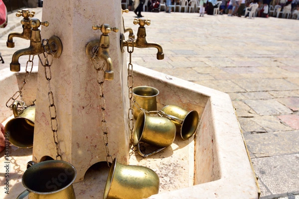 Obraz Copper taps for jewish ritual ablution, Jerusalem