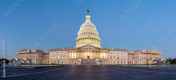 Fototapeta Panorama of the illuminated U.S. Capitol Building in Washington D.C. at dawn