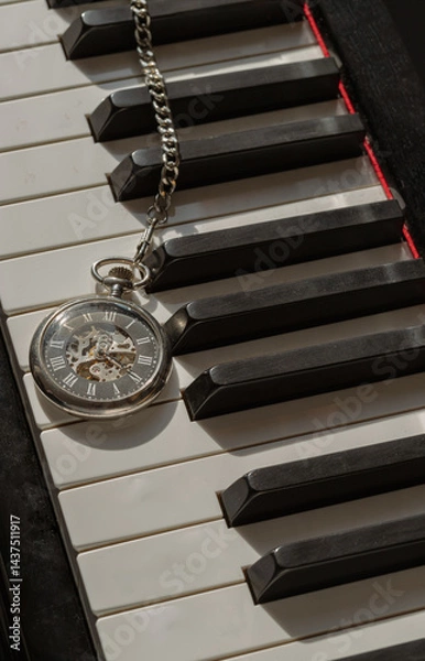 Obraz Antique pocket watch or Retro pocket watch on Piano keys background. "keys and time" use it as your Wallpaper, Poster and Space for text, Selective focus.