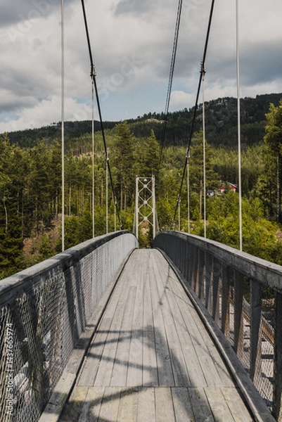 Obraz Old wooden bridge across the Hallingdalselva river flowing into Lake Kroderen in Norway, Scandinavia