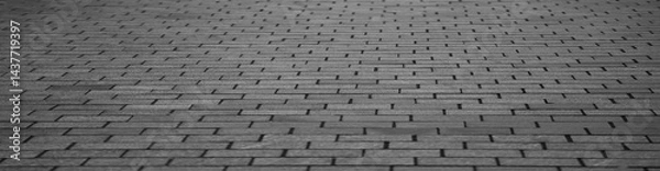Fototapeta grey gray texture of a stone old monotonous pavement with a perspective. Exterior surface floor pattern. Urban street  flooring tiles, construction background.  Prospect.