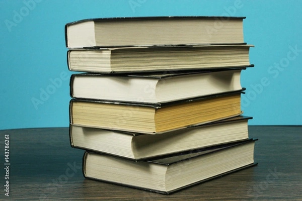 Fototapeta A stack of books on the table