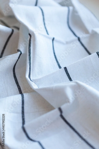 Obraz White Fabric with Black Stripes: This image captures the simplicity of white fabric adorned with sleek black stripes. Classic design in everyday materials.