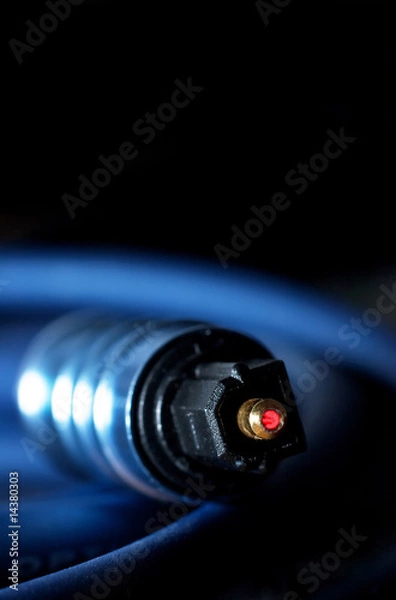 Fototapeta laser fiber optic link cable plug close up focus on it's tip