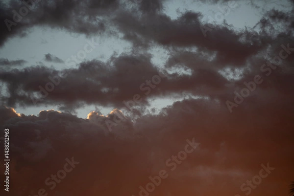 Obraz Sunset in the sky, at the end of summer in the Mediterranean, the sun's glare filters through the clouds, Spain, Valencia