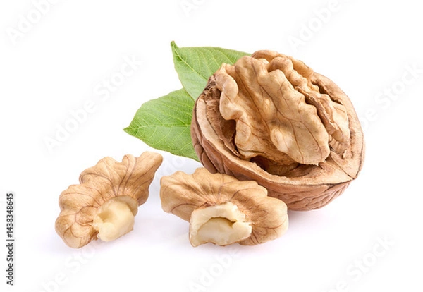 Fototapeta Walnuts with leaves on white background