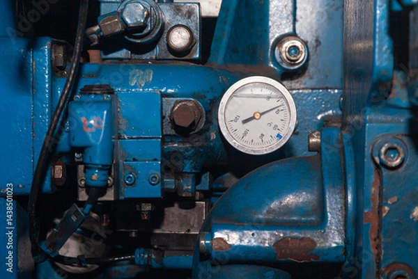 Obraz Part of a ship's propulsion system with a temperature gauge installed.