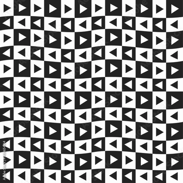 Fototapeta Black and white triangles arranged in a checkered grid. Checkered and vawy pattern with triangles.