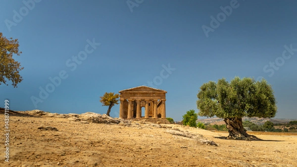 Fototapeta Valley of the Temples (Valle dei Templi) Temple of Concordia and the statue of Fallen Icarus, in the Valley of the Temples, Agrigento, Sicily, Italy. Travel and sightseeing journey concept