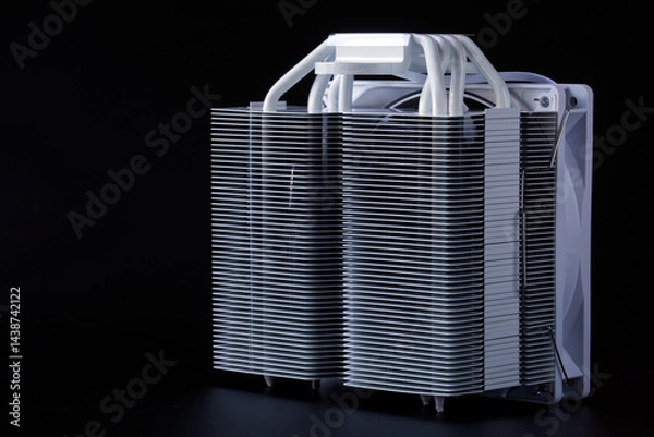 Fototapeta High-performance metal CPU cooler heatsink with heat pipes and fan on a tower radiator, perfect for tech product listings, hardware showcases, and e-commerce catalogs. Photo