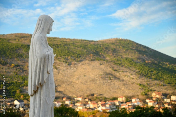 Obraz Statue of the Blessed Virgin Mary on Mount Podbrdo, the Apparition hill overlooking the village of Medjugorje in Bosnia and Herzegovina.