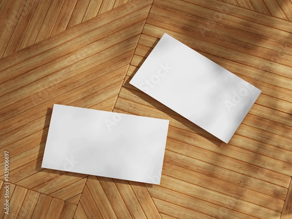 Fototapeta Business card mockup featuring two cards set against wooden background, showcasing a simple yet elegant design.