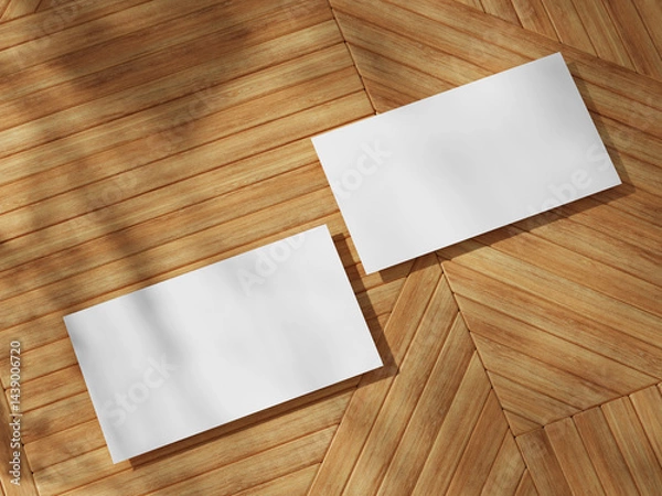 Fototapeta Classic business card mockup on wooden floor with a symmetrical layout, great for showcasing designs.
